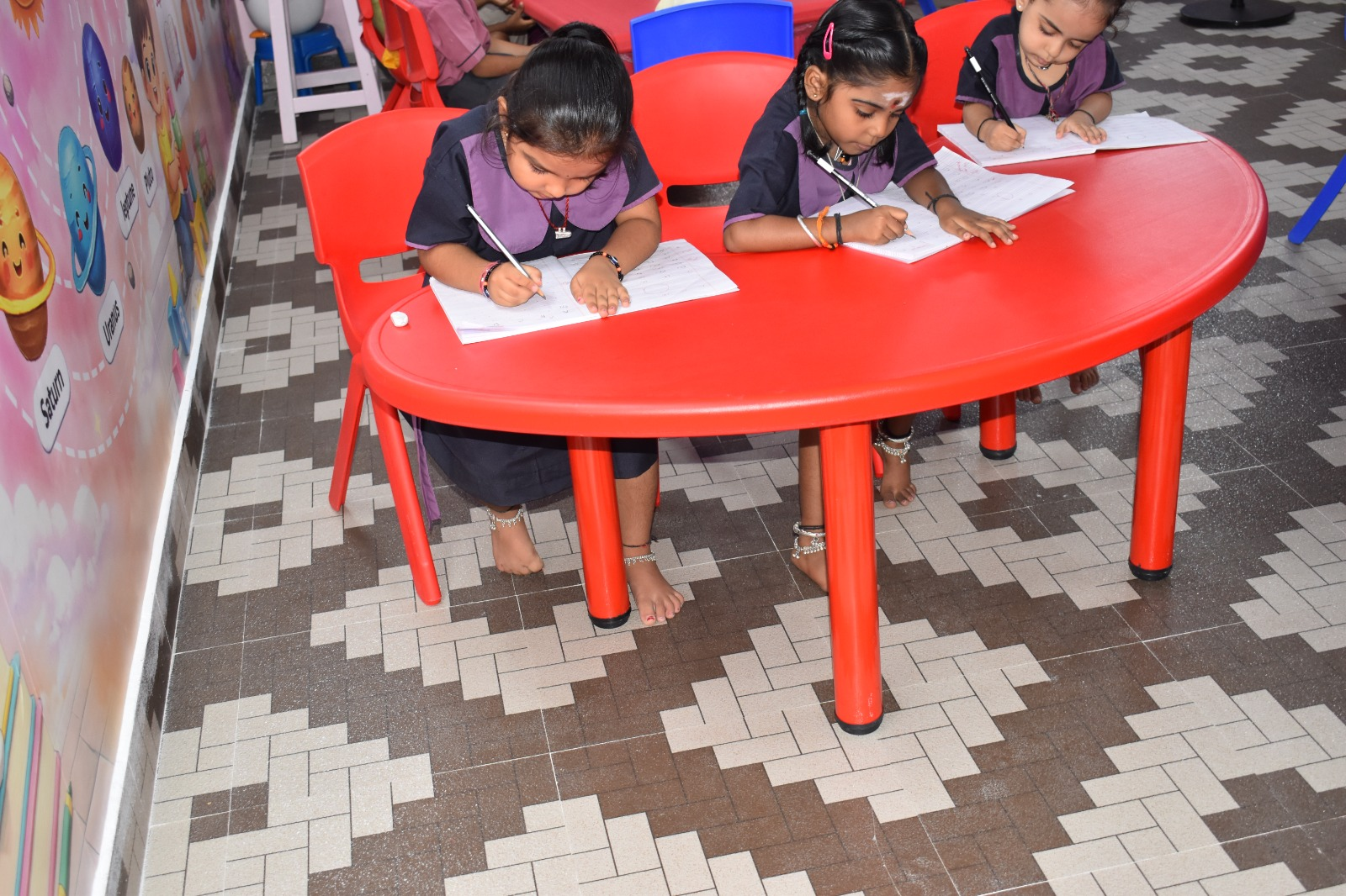 Focused writing practice at the red table