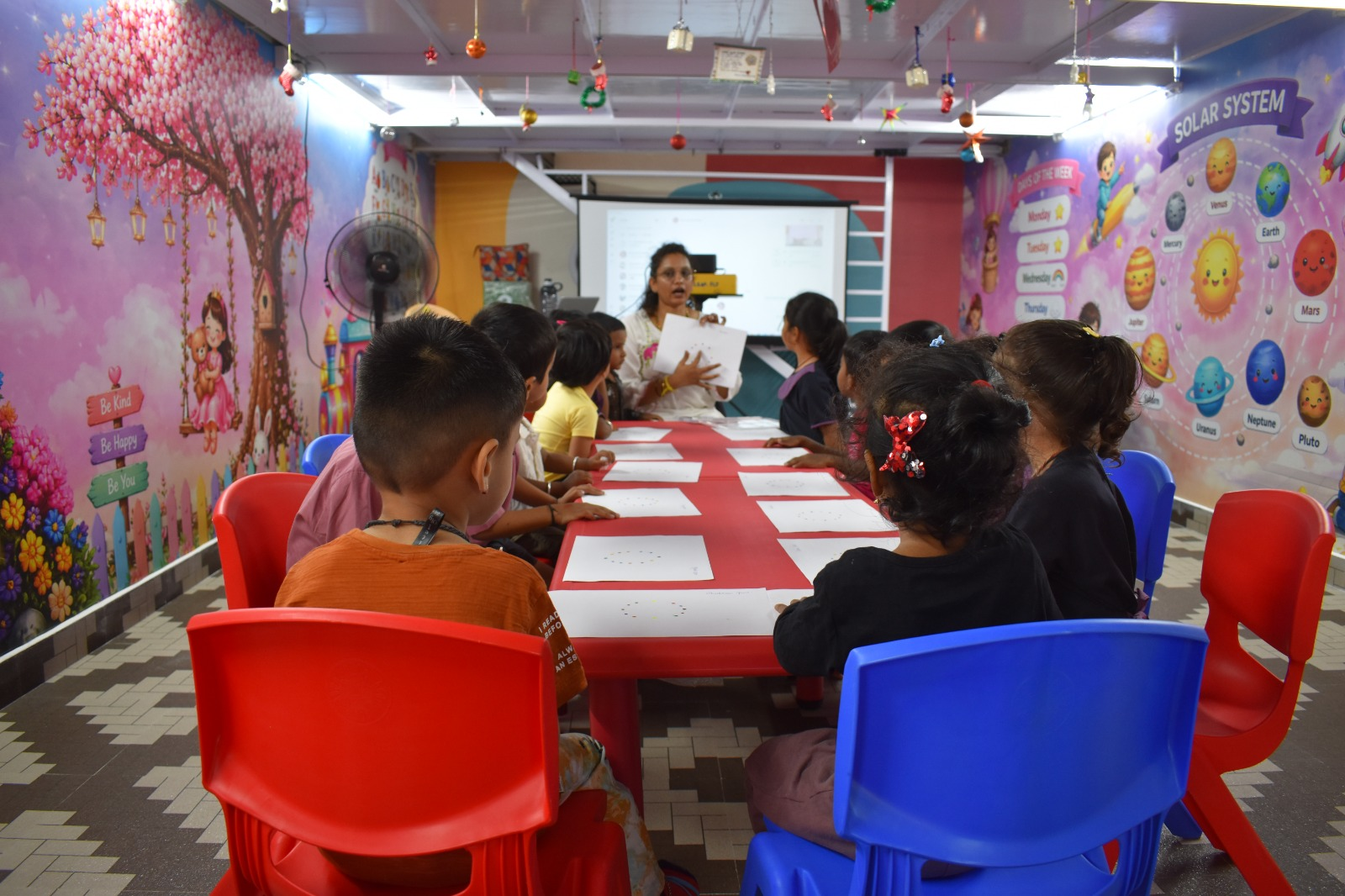 Teacher leading a group activity with the class