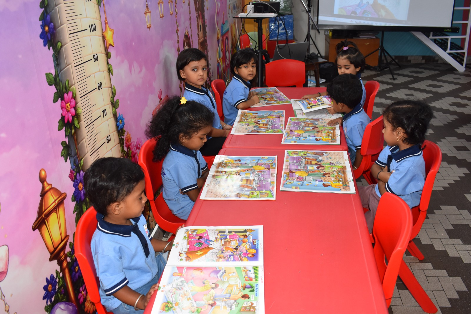 Picture-reading time with our little ones in uniform