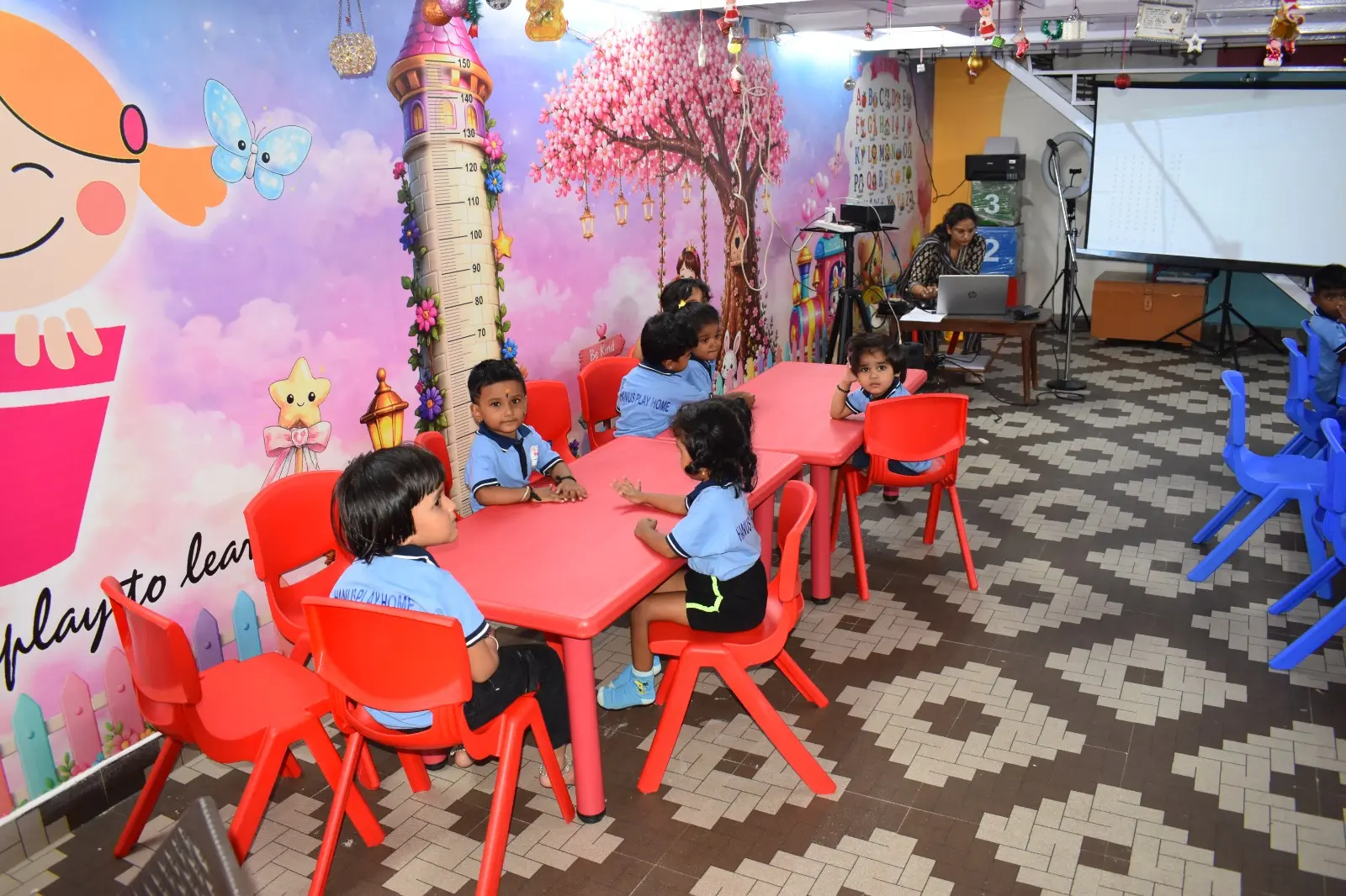 Our colourful classroom with the ‘play to learn’ mural