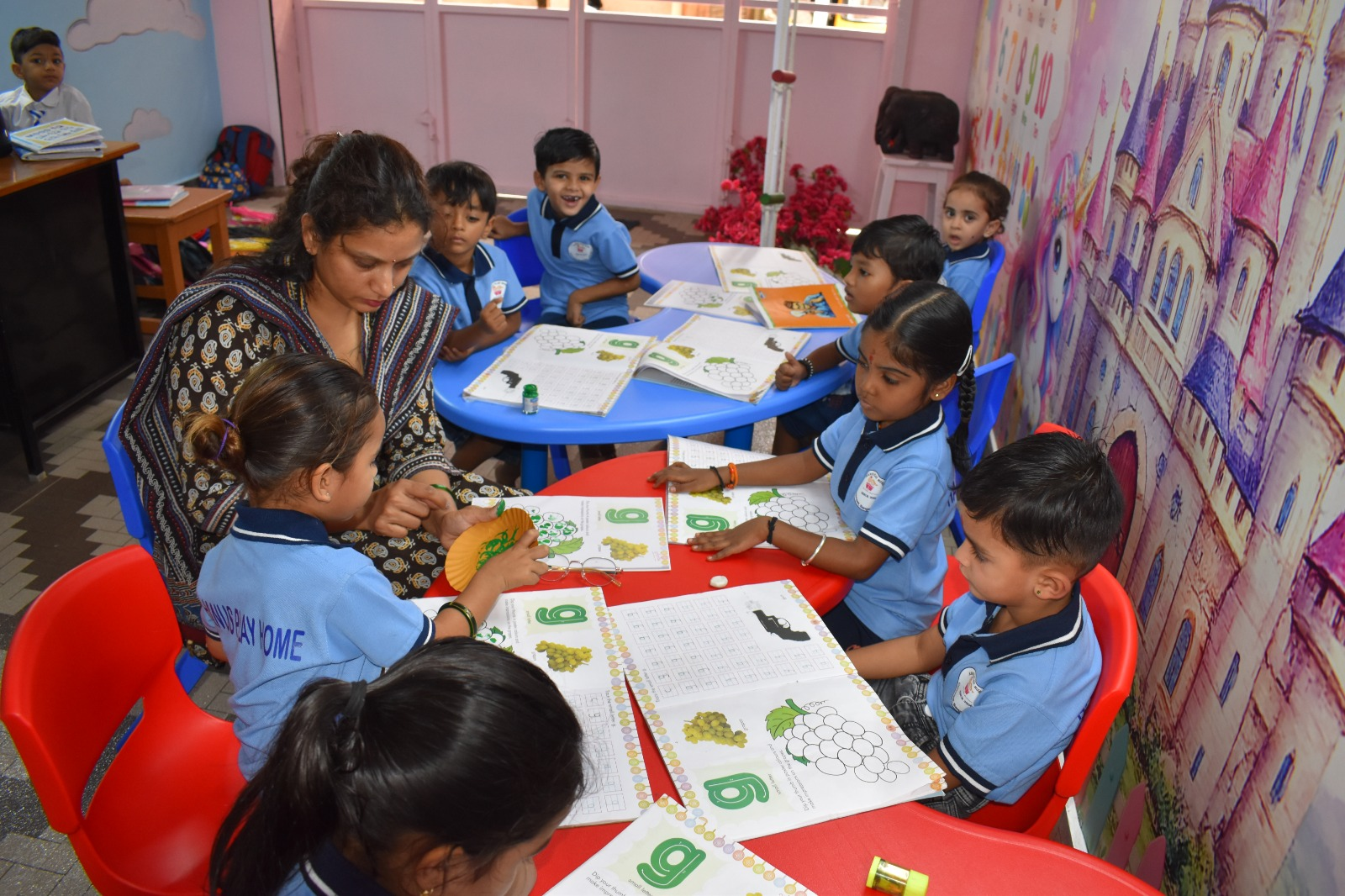 Happy preschool children playing with Montessori materials at Hanus Play Home